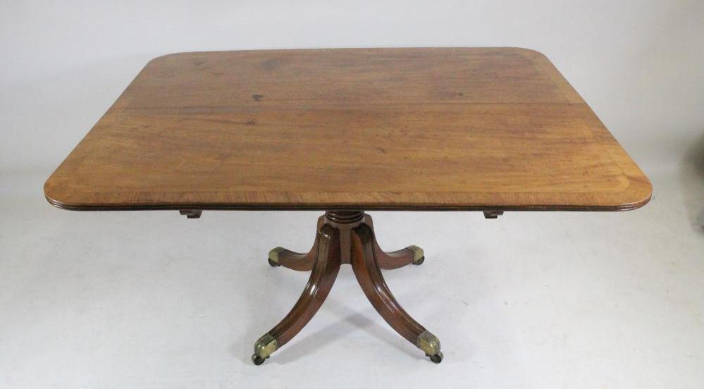 A MAHOGANY BREAKFAST TABLE Image