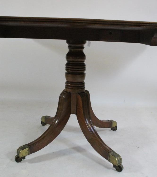 A MAHOGANY BREAKFAST TABLE Image