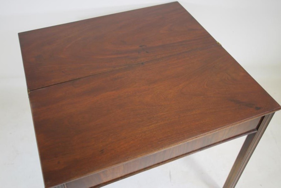 A GEORGIAN MAHOGANY FOLDING TEA TABLE Image
