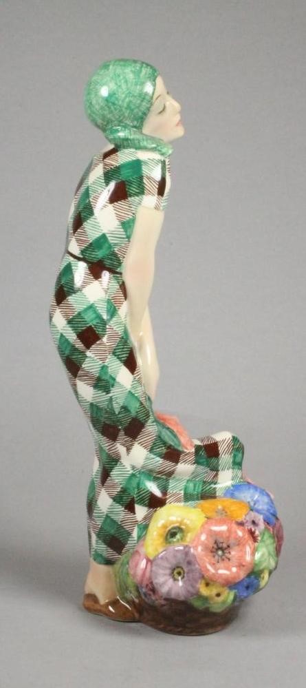 AN ART DECO IGNI OF TORINO EARTHENWARE FIGURE of a young flower seller wearing a green headscarf and Image