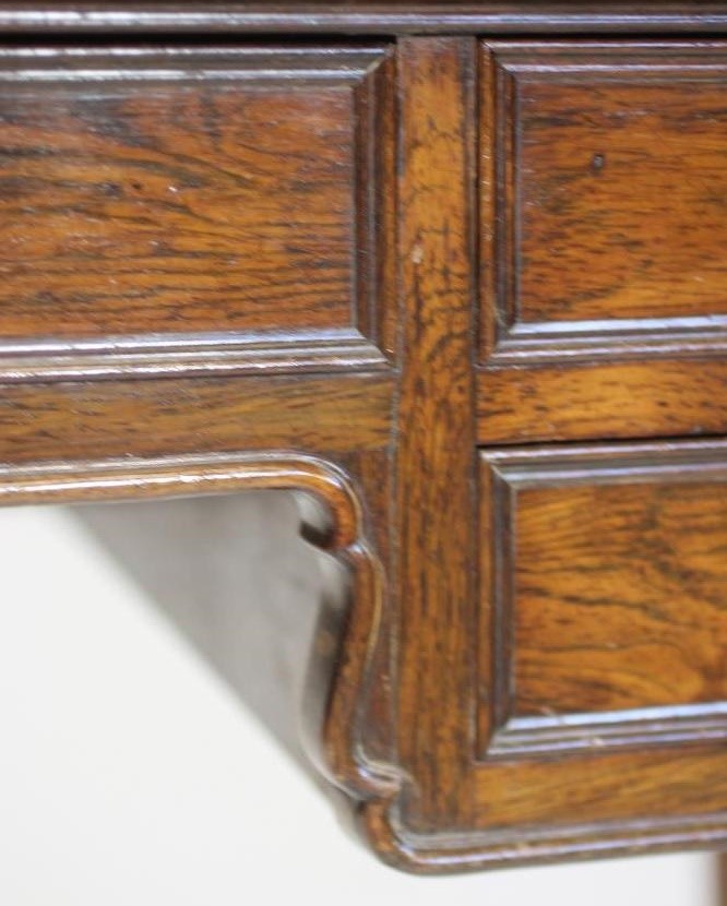 A NAPOLEON III ROSEWOOD WRITING TABLE of oblong form with protruding corners on turned tapering Image