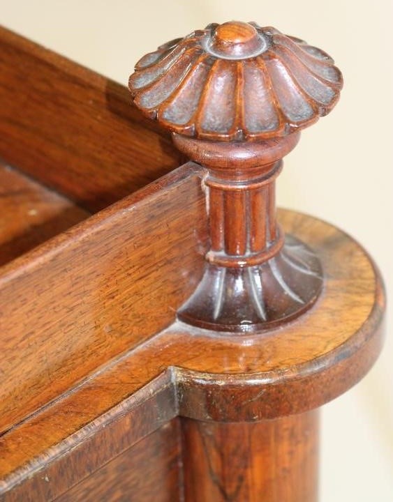 A NAPOLEON III ROSEWOOD WRITING TABLE of oblong form with protruding corners on turned tapering Image