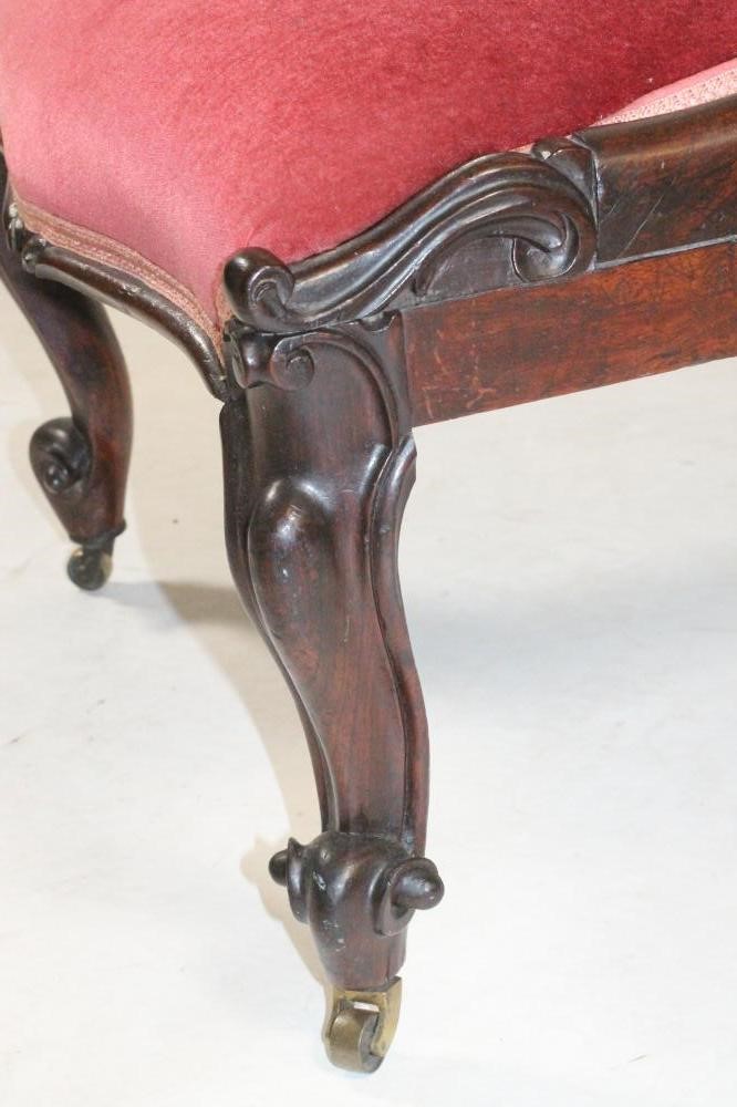 A VICTORIAN ROSEWOOD FRAMED NURSING CHAIR of Grecian design Image