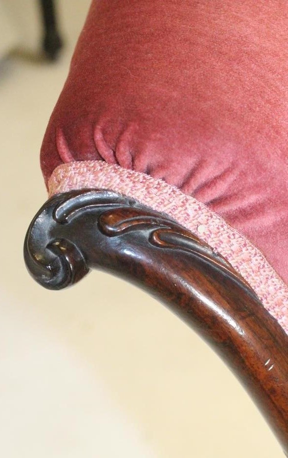 A VICTORIAN ROSEWOOD FRAMED NURSING CHAIR of Grecian design Image