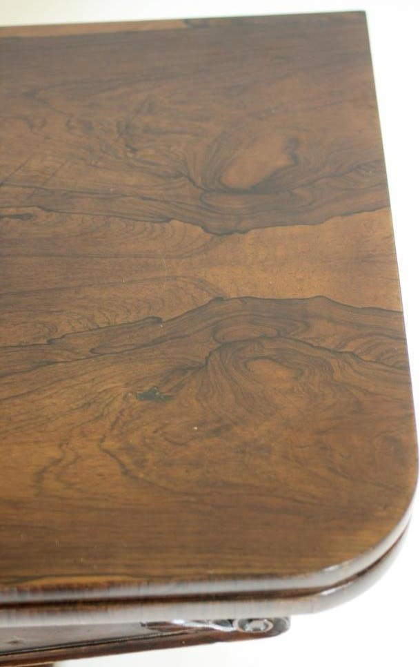 A WILLIAM IV ROSEWOOD FOLDING CARD TABLE of rounded oblong form Image