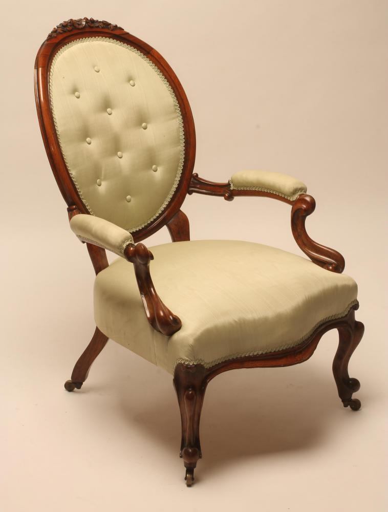 A VICTORIAN WALNUT FRAMED SALON CHAIR button upholstered in pale green watered silk Image