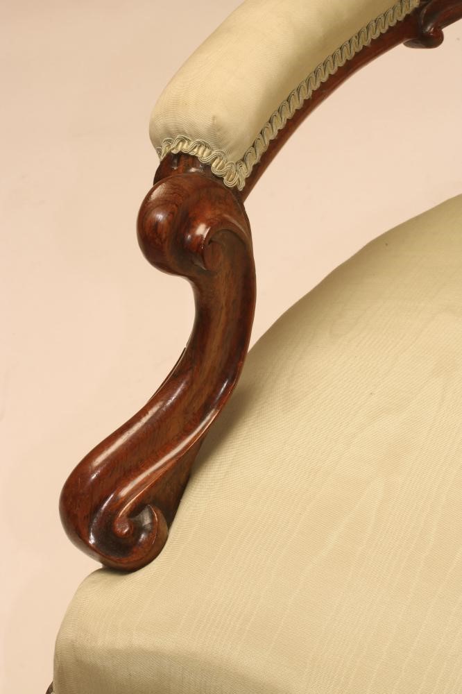 A VICTORIAN WALNUT FRAMED SALON CHAIR button upholstered in pale green watered silk Image