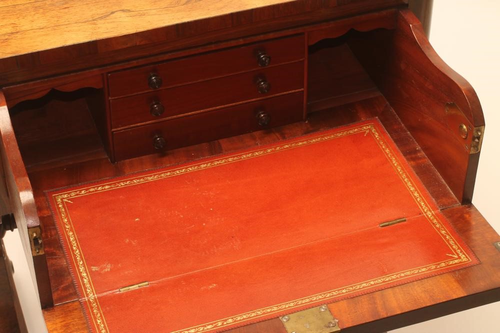 A LADY'S REGENCY ROSEWOOD SMALL SECRETAIRE of rounded oblong form Image