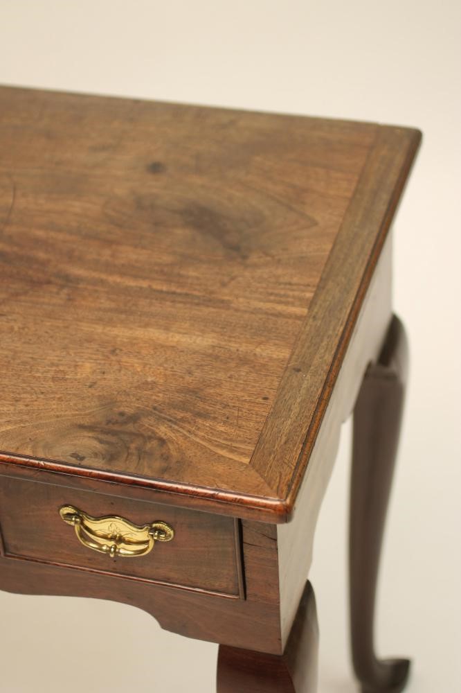 A VICTORIAN MAHOGANY DINING TABLE of rounded oblong form with pull out action and a separate leaf Image