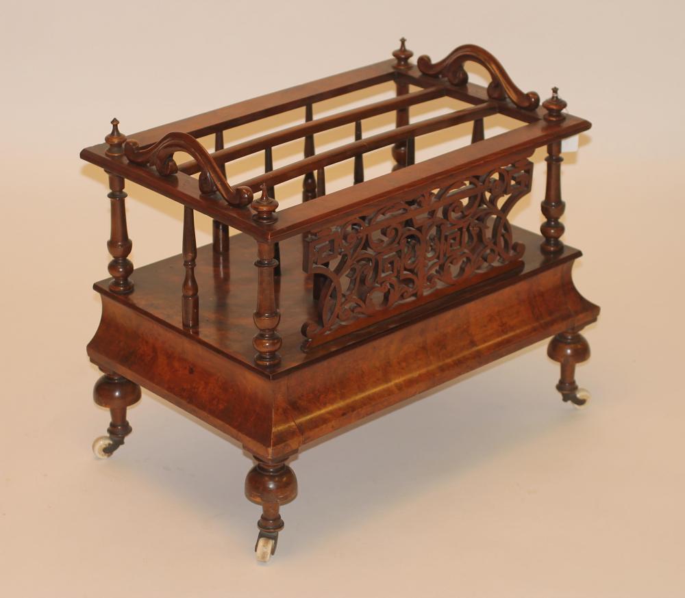 A VICTORIAN BURR WALNUT CANTERBURY of oblong form with three divisions on spindle supports and Image