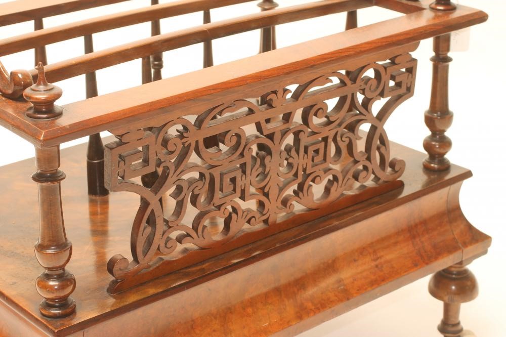 A VICTORIAN BURR WALNUT CANTERBURY of oblong form with three divisions on spindle supports and Image