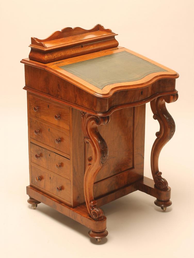 A VICTORIAN WALNUT DAVENPORT Image