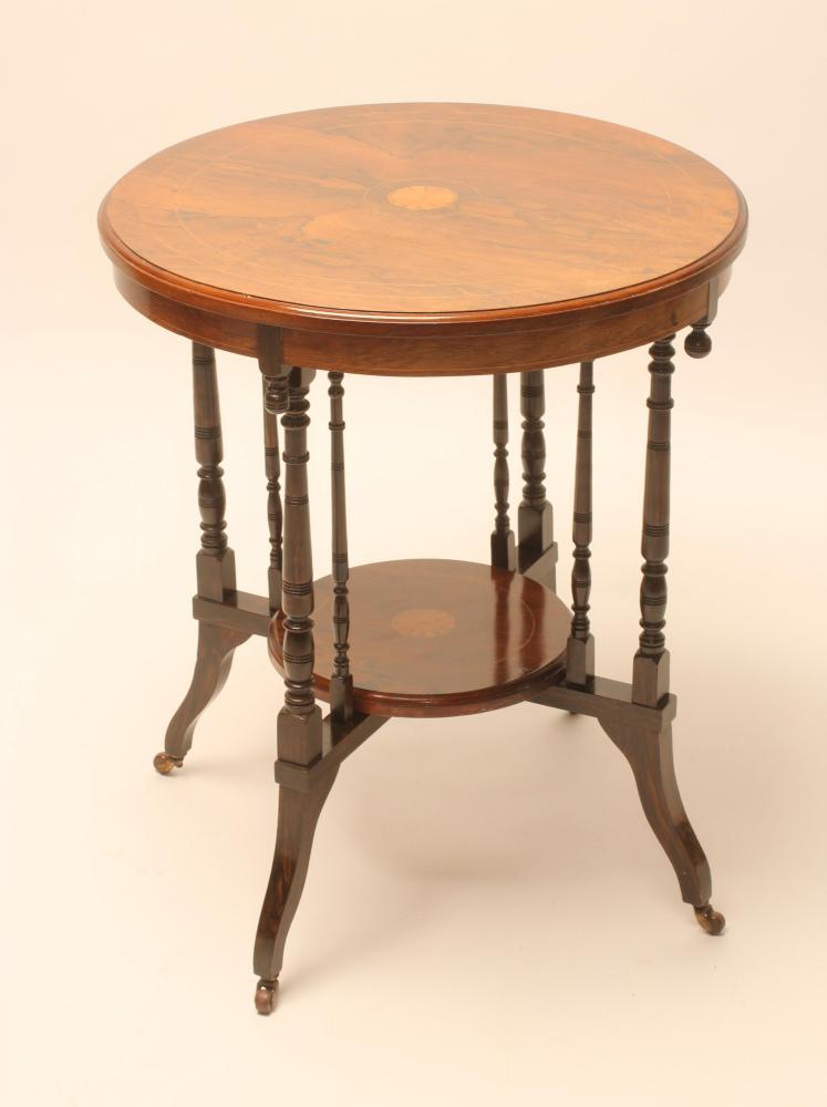 A VICTORIAN ROSEWOOD OCCASIONAL TABLE of circular form with stringing and marquetry batwing roundels Image