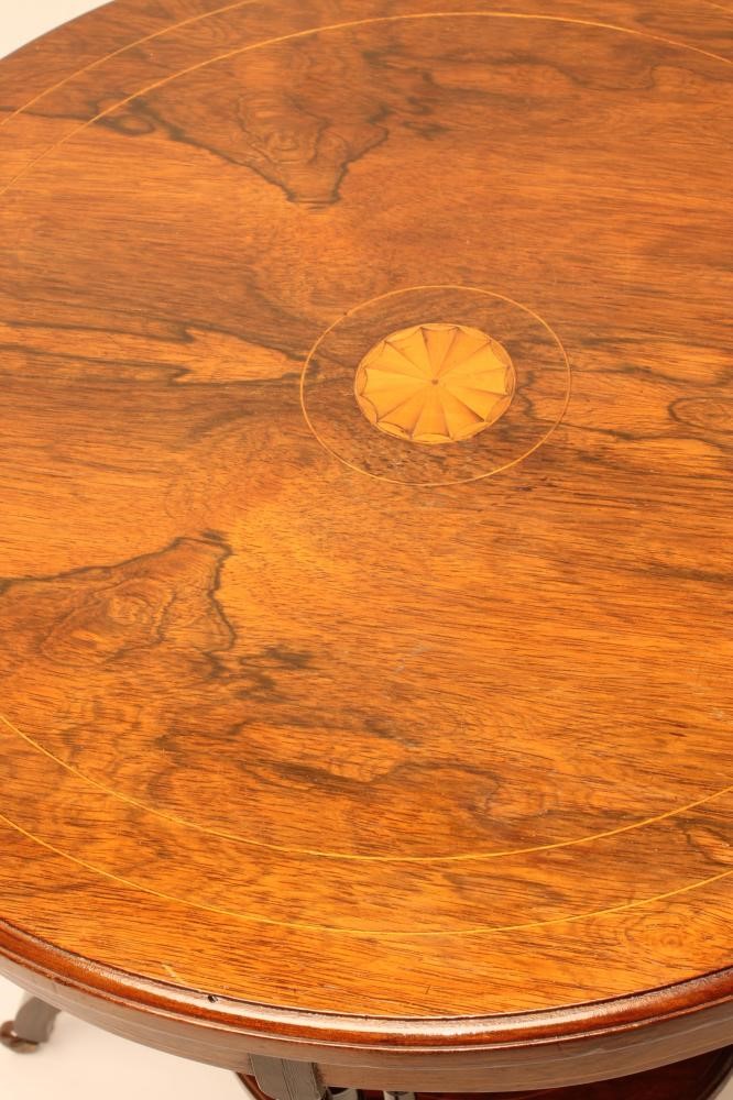 A VICTORIAN ROSEWOOD OCCASIONAL TABLE of circular form with stringing and marquetry batwing roundels Image