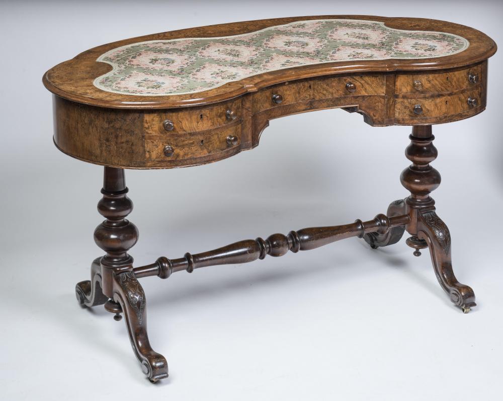 A LADY'S VICTORIAN WALNUT PILLAR END DESK of kidney form Image