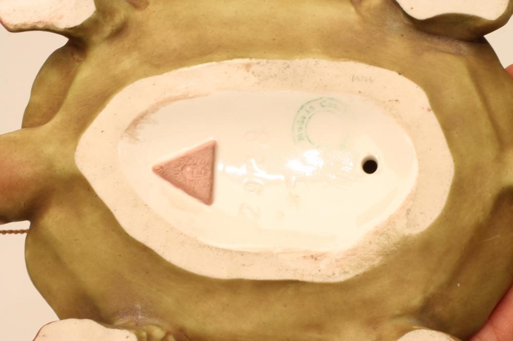 AN ART NOUVEAU ROYAL DUX BISQUE PORCELAIN FIGURE modelled as a naked maiden standing on the back of Image