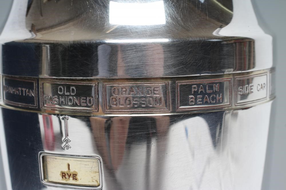 AN ART DECO EPNS RECIPE COCKTAIL SHAKER of flared cylindrical form with lift-off domed cover Image