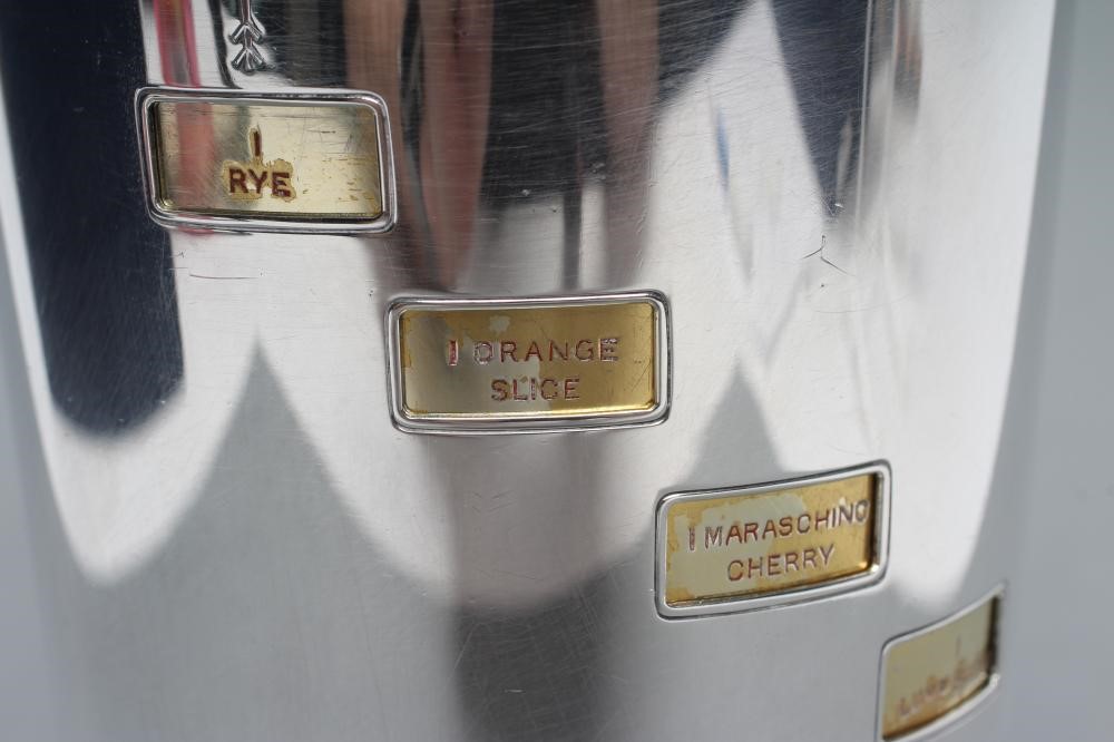 AN ART DECO EPNS RECIPE COCKTAIL SHAKER of flared cylindrical form with lift-off domed cover Image