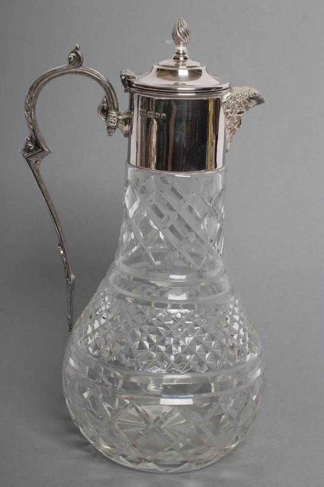 A SILVER MOUNTED CLEAR GLASS CLARET JUG Image