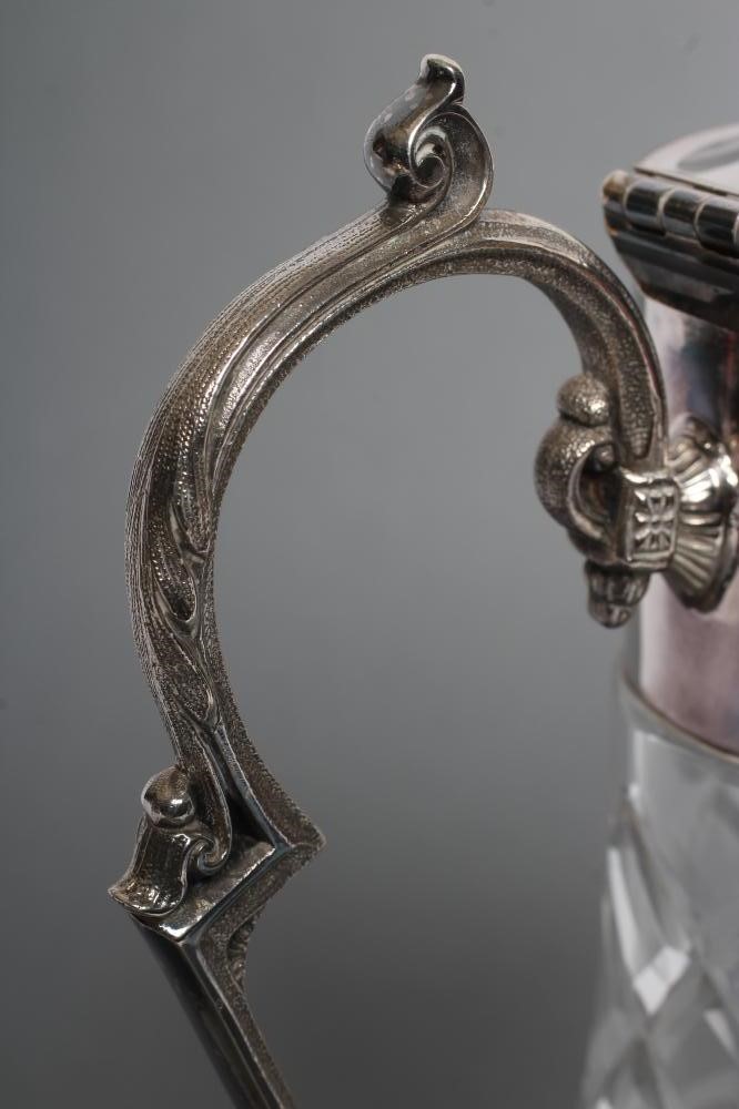 A SILVER MOUNTED CLEAR GLASS CLARET JUG Image