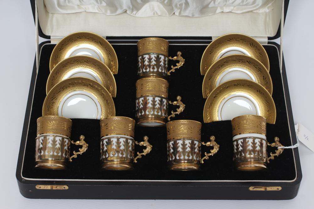 A SET OF SIX J. POUYAT LIMOGES PORCELAIN CANS AND SAUCERS with raised and burnished foliate gilded Image