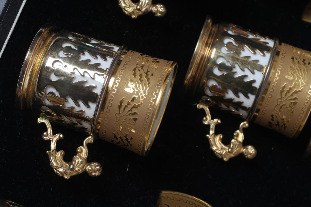 A SET OF SIX J. POUYAT LIMOGES PORCELAIN CANS AND SAUCERS with raised and burnished foliate gilded Image