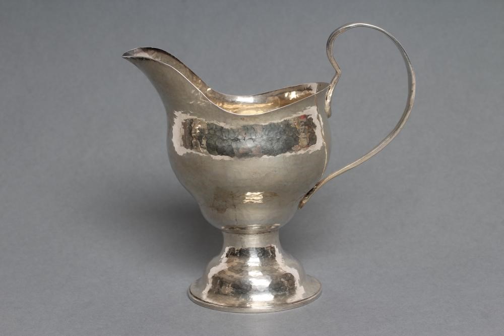 AN ARTS AND CRAFTS SILVER JUG Image