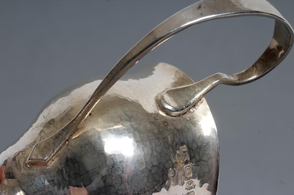 AN ARTS AND CRAFTS SILVER JUG Image