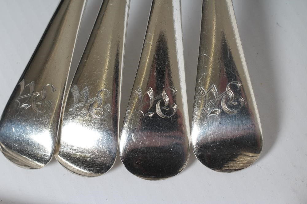 A SET OF TWELVE SILVER DESSERT SPOONS AND FORKS Image
