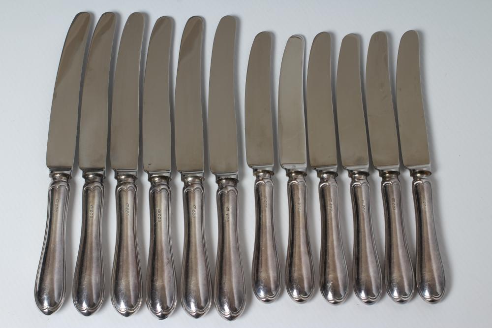 A SET OF SIX SILVER HANDLED TABLE AND DESSERT KNIVES Image