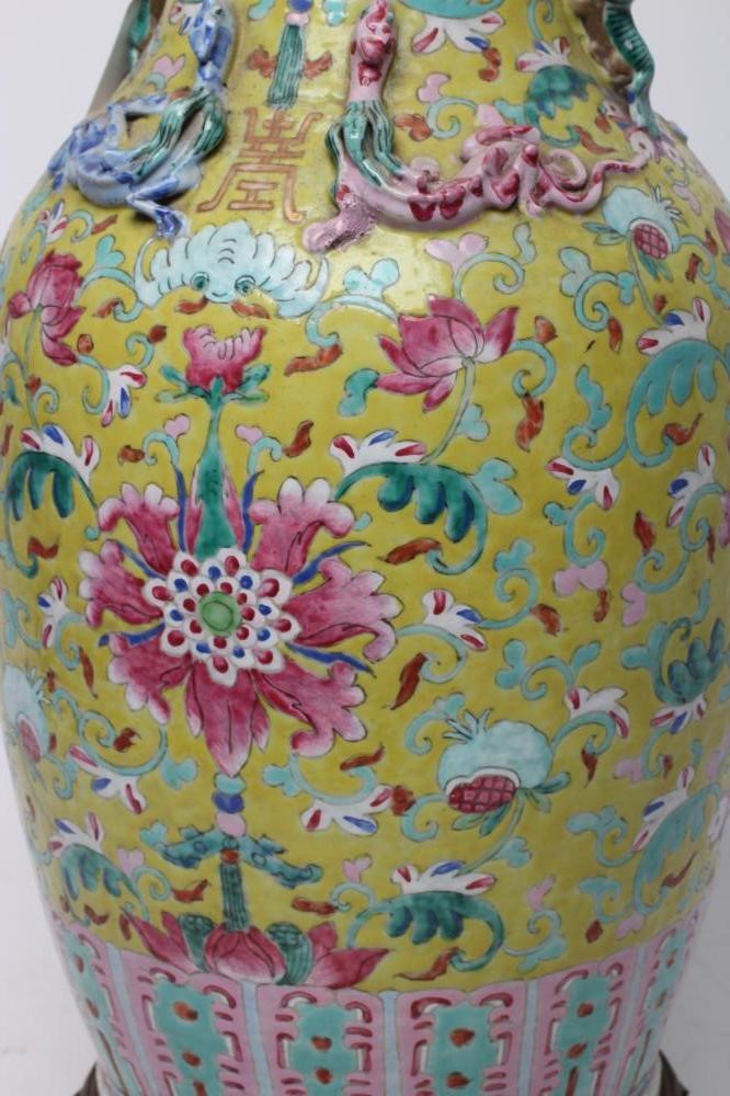 A CHINESE PORCELAIN VASE of baluster form with everted shaped rim and two shi-shi handles Image