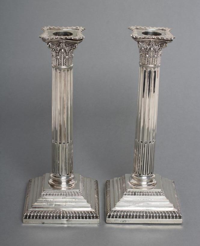 A PAIR OF LATE VICTORIAN SILVER CORINTHIAN COLUMN CANDLESTICKS Image