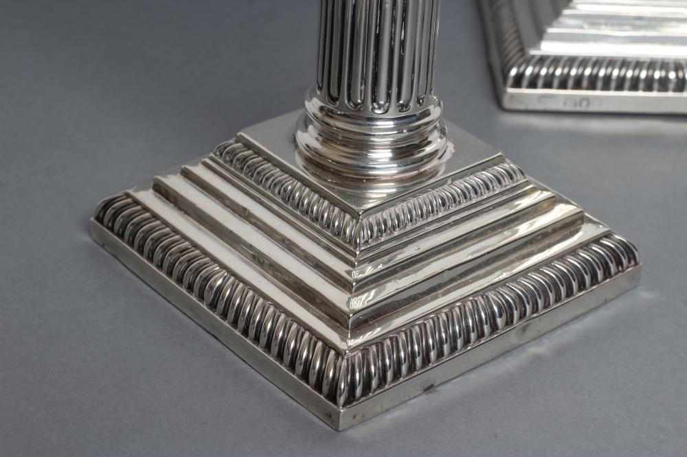 A PAIR OF LATE VICTORIAN SILVER CORINTHIAN COLUMN CANDLESTICKS Image