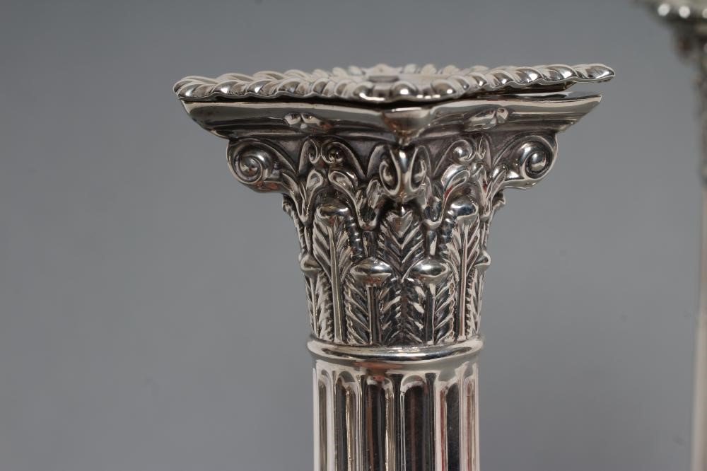 A PAIR OF LATE VICTORIAN SILVER CORINTHIAN COLUMN CANDLESTICKS Image