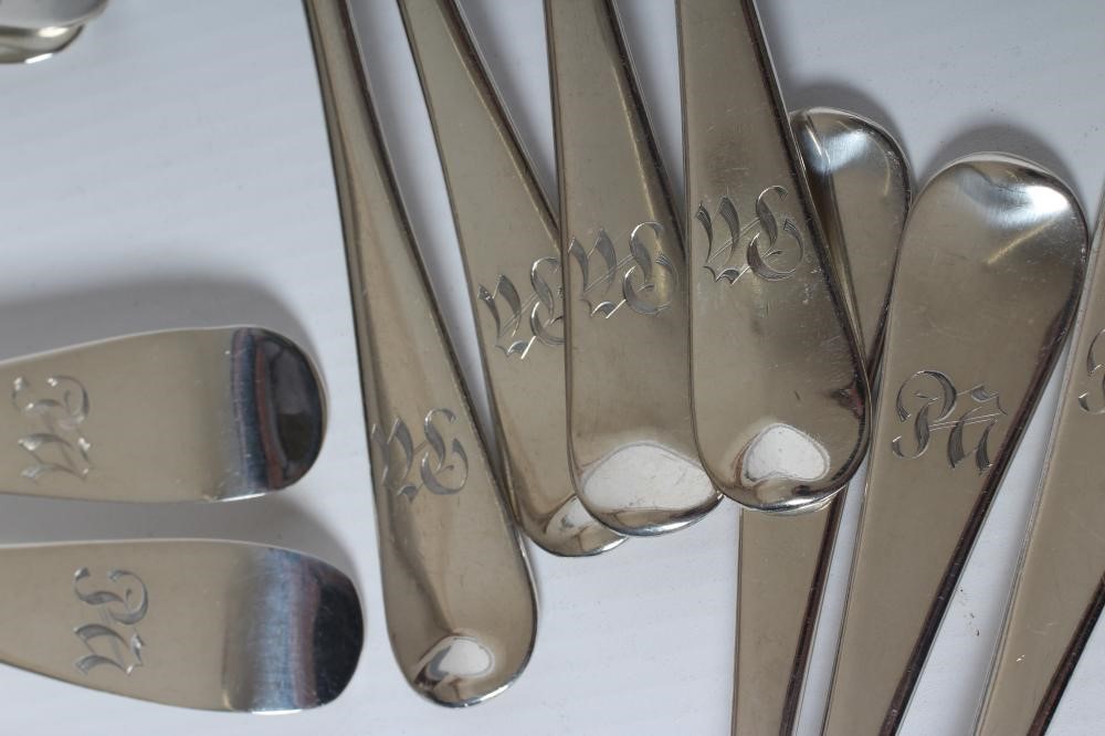 A COLLECTION OF SILVER FLATWARE comprising twelve teaspoons Image