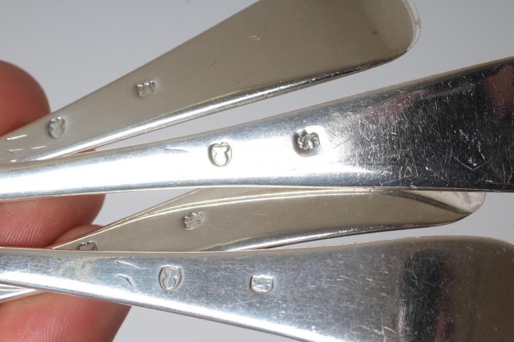 A COLLECTION OF SILVER FLATWARE comprising twelve teaspoons Image