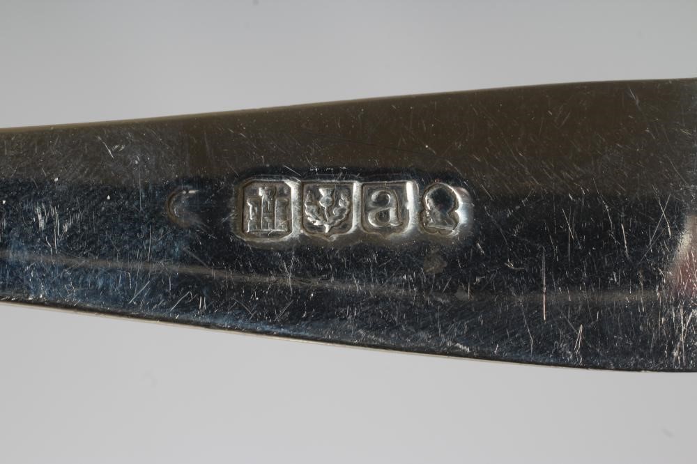 A SET OF EIGHT GEORGE III SILVER TABLESPOONS Image