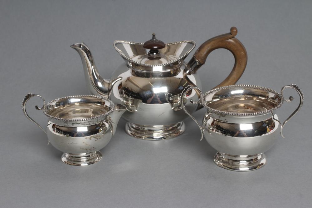 A LATE VICTORIAN SILVER THREE PIECE BACHELOR'S TEA SERVICE Image