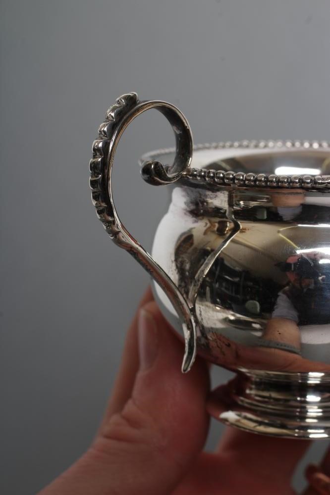 A LATE VICTORIAN SILVER THREE PIECE BACHELOR'S TEA SERVICE Image