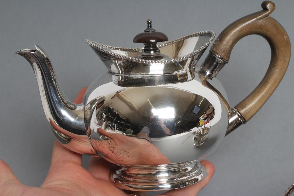 A LATE VICTORIAN SILVER THREE PIECE BACHELOR'S TEA SERVICE Image