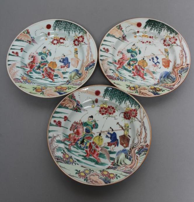 A SET OF THREE CHINESE PORCELAIN FAMILLE ROSE PLATES painted with a horseman fording a stream Image