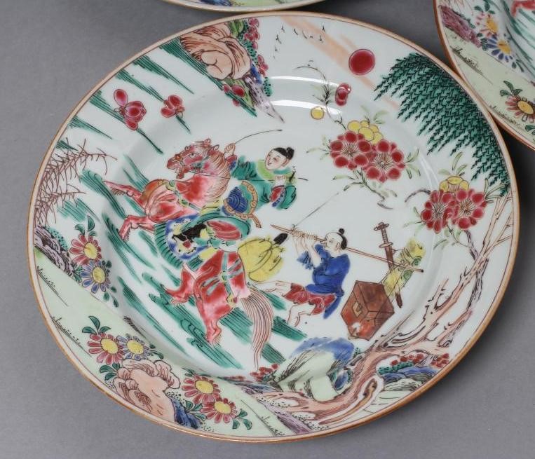 A SET OF THREE CHINESE PORCELAIN FAMILLE ROSE PLATES painted with a horseman fording a stream Image