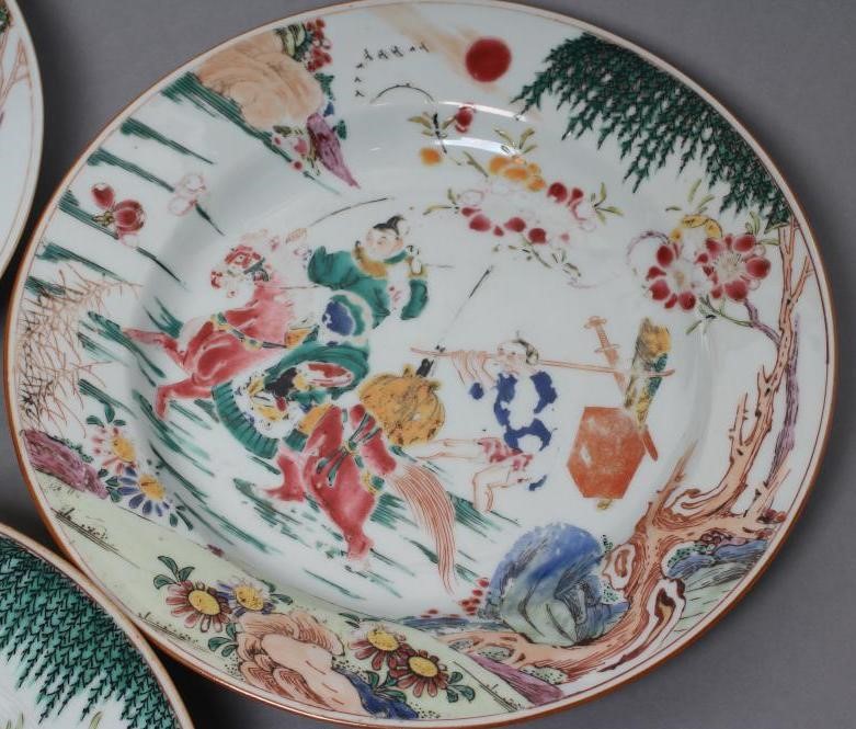 A SET OF THREE CHINESE PORCELAIN FAMILLE ROSE PLATES painted with a horseman fording a stream Image