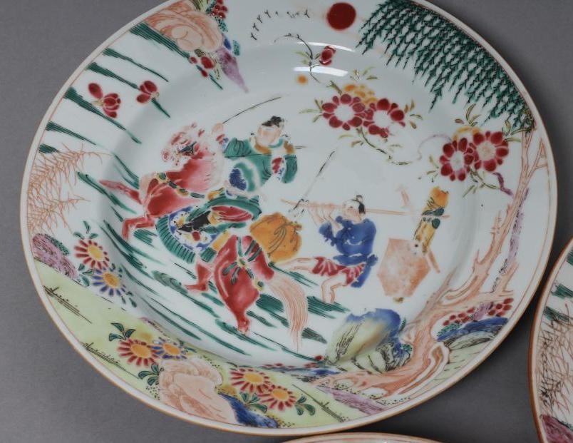 A SET OF THREE CHINESE PORCELAIN FAMILLE ROSE PLATES painted with a horseman fording a stream Image