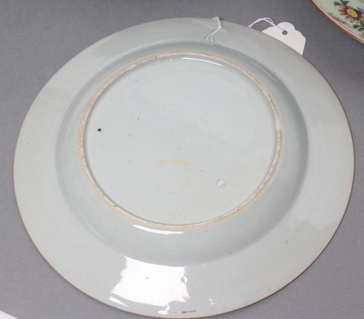 A SET OF THREE CHINESE PORCELAIN FAMILLE ROSE PLATES painted with a horseman fording a stream Image