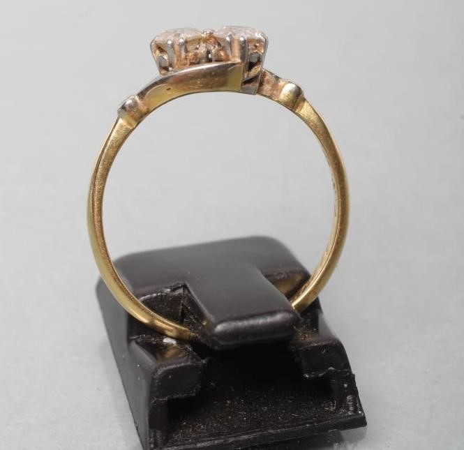 A TWO STONE DIAMOND CROSSOVER RING Image