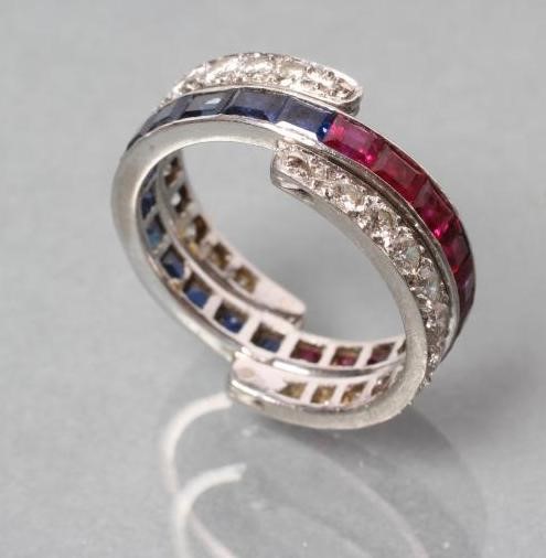 A DIAMOND, RUBY AND SAPPHIRE ETERNITY RING Image