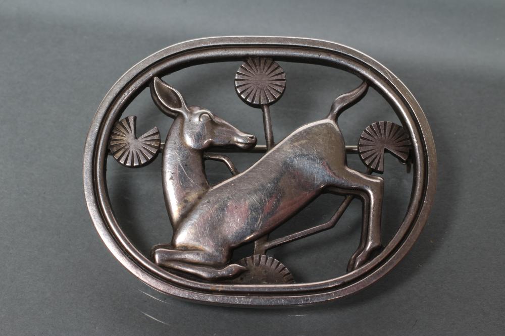 A GEORG JENSEN SILVER KNEELING DEER BROOCH Image