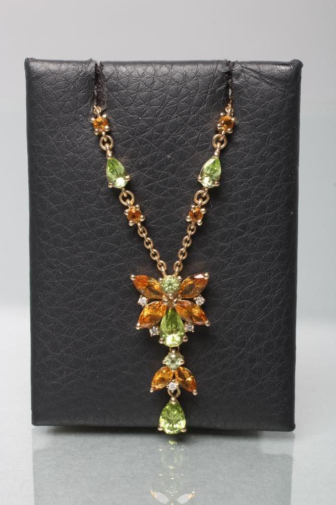 A BUTTERFLY PENDANT with citrine wings and peridot head and thorax Image