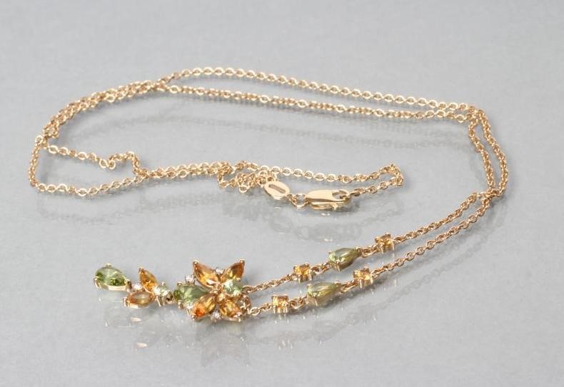 A BUTTERFLY PENDANT with citrine wings and peridot head and thorax Image